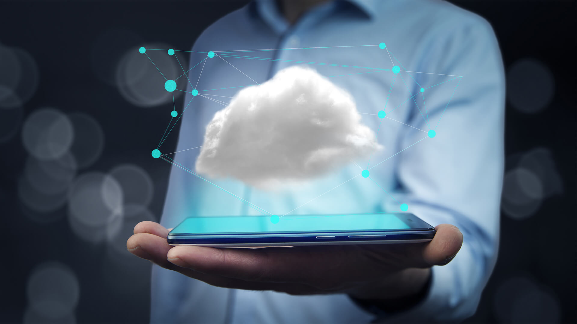 Man holding a tablet with a cloud about it