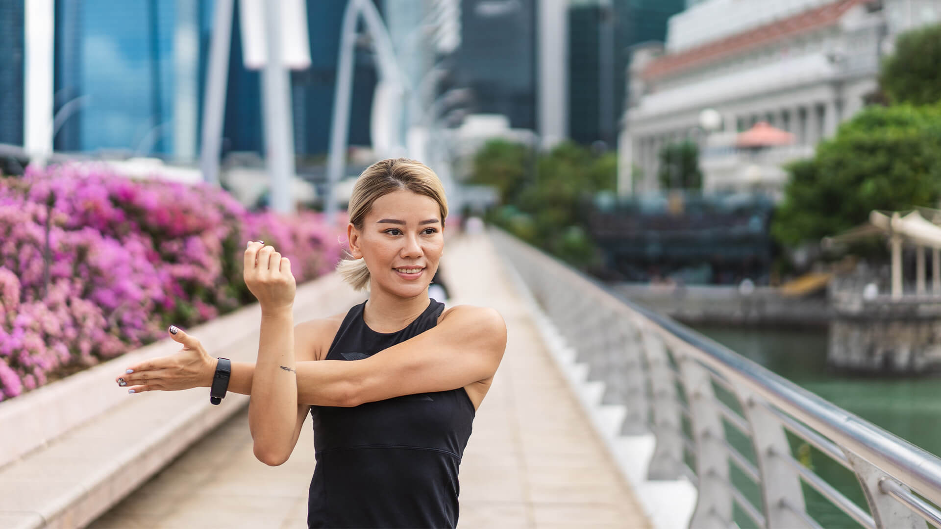 Woman stretching during a run in Singapore