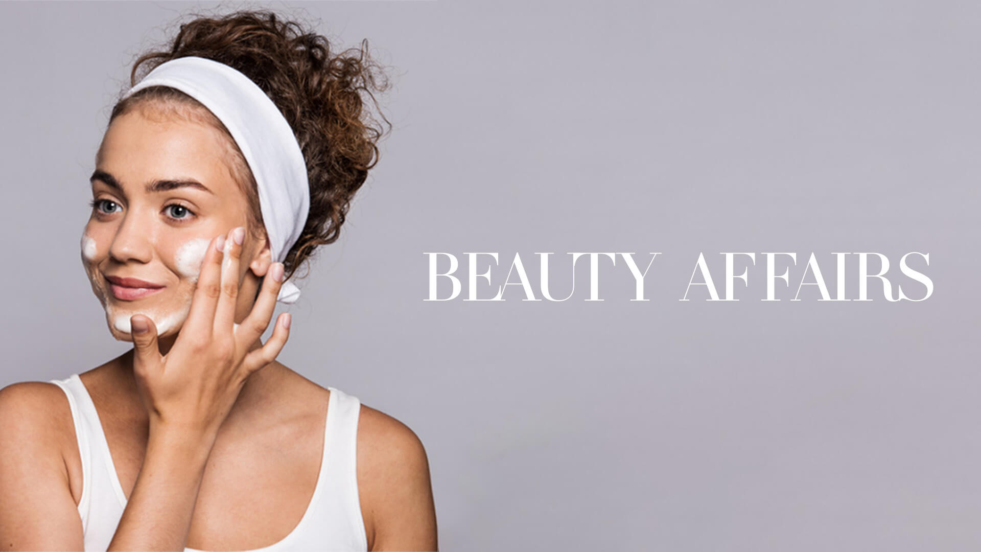 Woman applying cream to her face. Beauty Affairs company logo is to the right side of the image